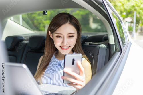 businesswoman use phone in car