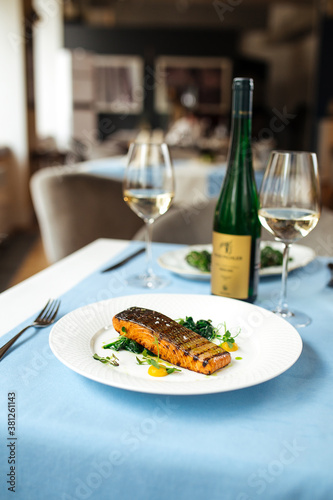 Grilled salmon fillet steak on the blue table