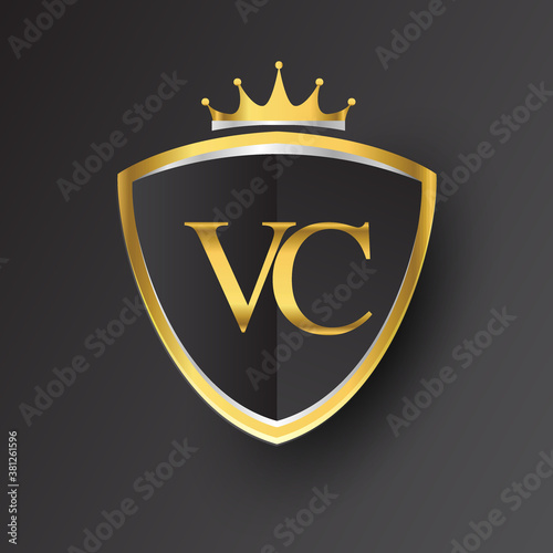 Initial logo letter VC with shield and crown Icon golden color isolated on black background, logotype design for company identity.