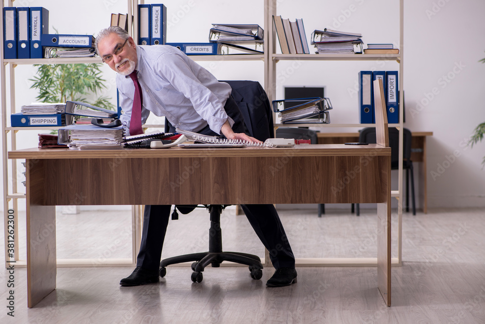 Old male employee unhappy with excessive work Old male employee unhappy with excessive work