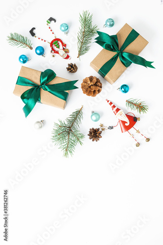 Christmas decorations and gift box on white background with copy space top view