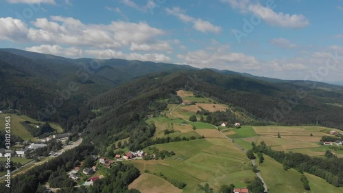 Flying over mountain Polom in Beskid Sadecki Mountains near village Rytro, Poland. View of Radziejowa Range. photo