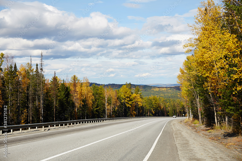 Fototapeta premium Beautiful asphalt roadway to lake Baikal on a Sunny autumn day, Russia.