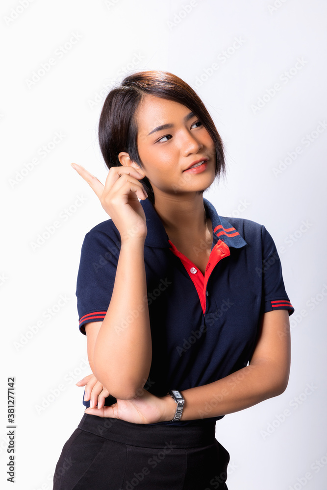 Portrait of cheerful young Asian woman finger her pointing up with smiling delighted face, yes gesture, celebrating success Portrait of cheerful young Asian woman finger her pointing up with smiling delighted face, yes gesture, celebrating success
