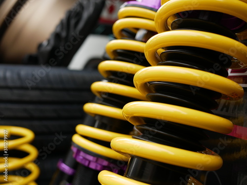Schilderij op canvas shock absorbers of car at garage.