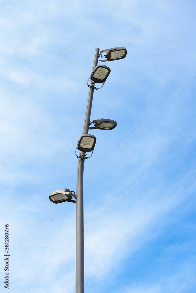 modern street lamp with LED lamps on blue sky background