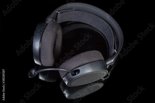 Top view of headset with circumaural earpads on dark surface photo