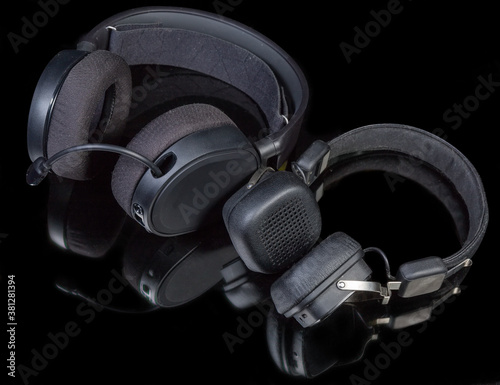 Headset and headphones with different earpads types on dark surface photo