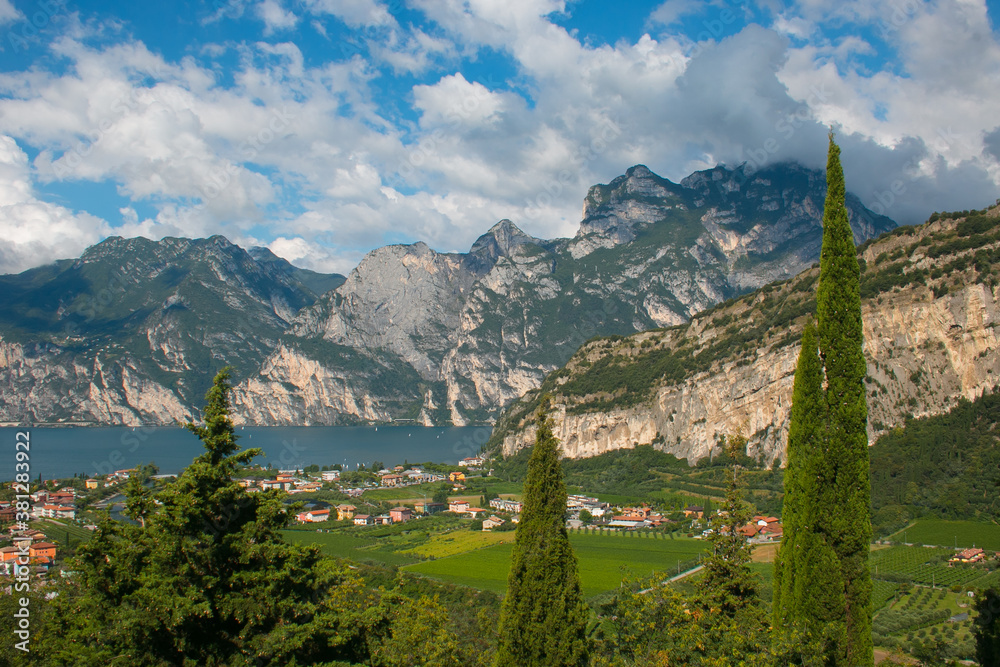 The panorama of Riva del Garda and Lago di Garda lake on summer day in Trentino