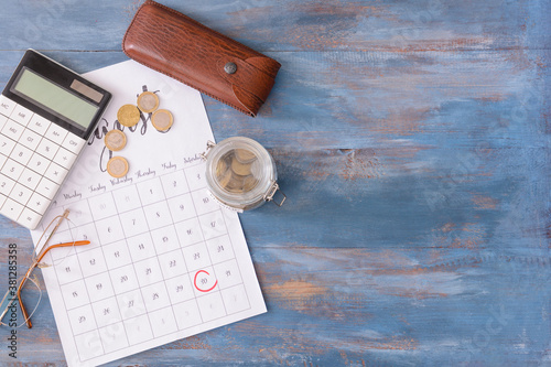 Jar with savings, calendar ...