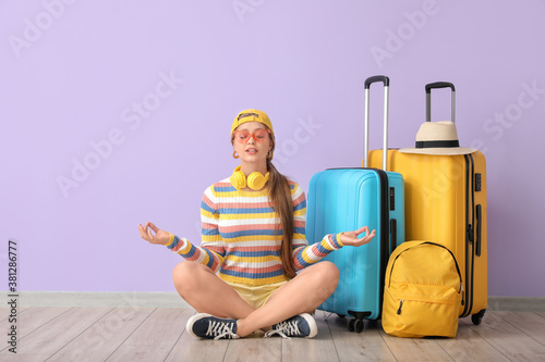 Young woman with luggage me...