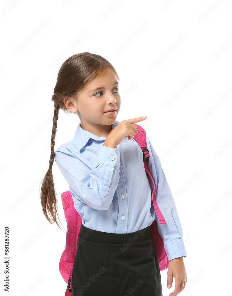 Little schoolgirl pointing at something on white background Little schoolgirl pointing at something on white background