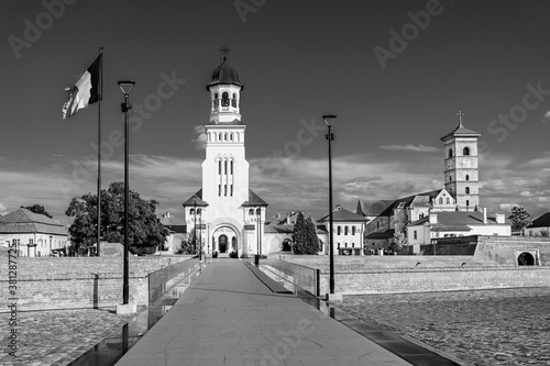 The coronation orthodox cathedral and the catholoc cathedral inside Alba Carolina citadel in Alba Iulia, Transylvania, Romania photo