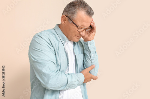 Stressed mature man on colo...