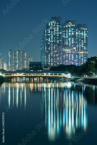 High rise residential building and mountain in Hong Kong city at night