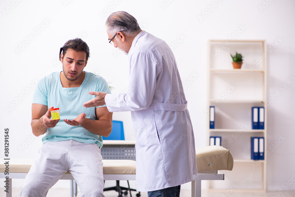 Fototapeta premium Young male patient visiting experienced doctor