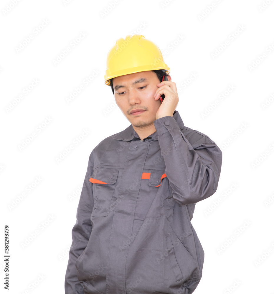 Migrant worker wearing yellow helmet is calling Migrant worker wearing yellow helmet is calling