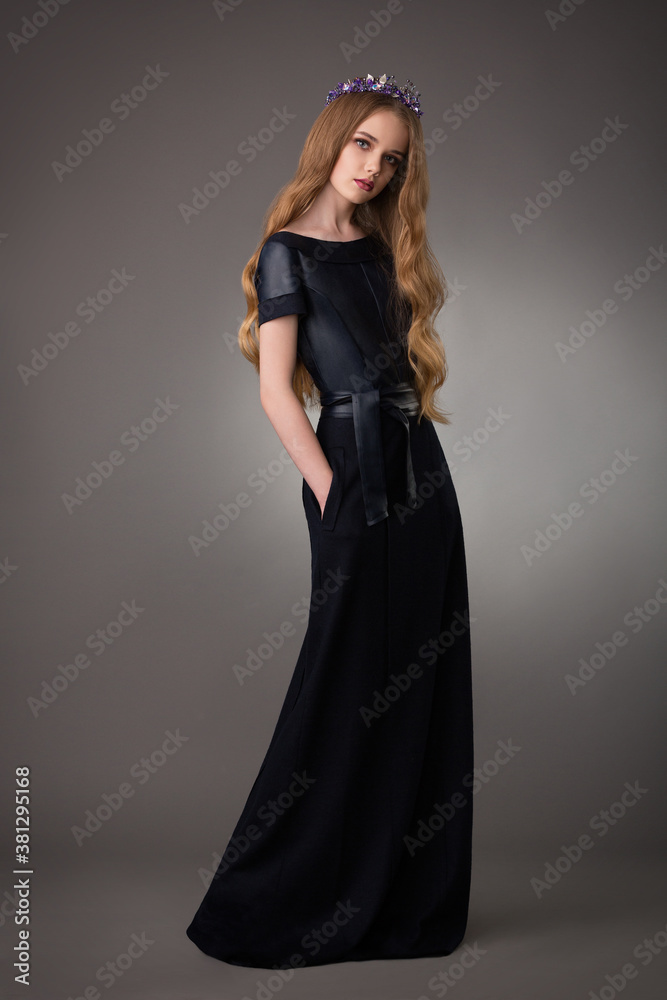 beautiful teen blonde girl with exquisite makeup in a stylish black dress beautiful teen blonde girl with exquisite makeup in a stylish black dress