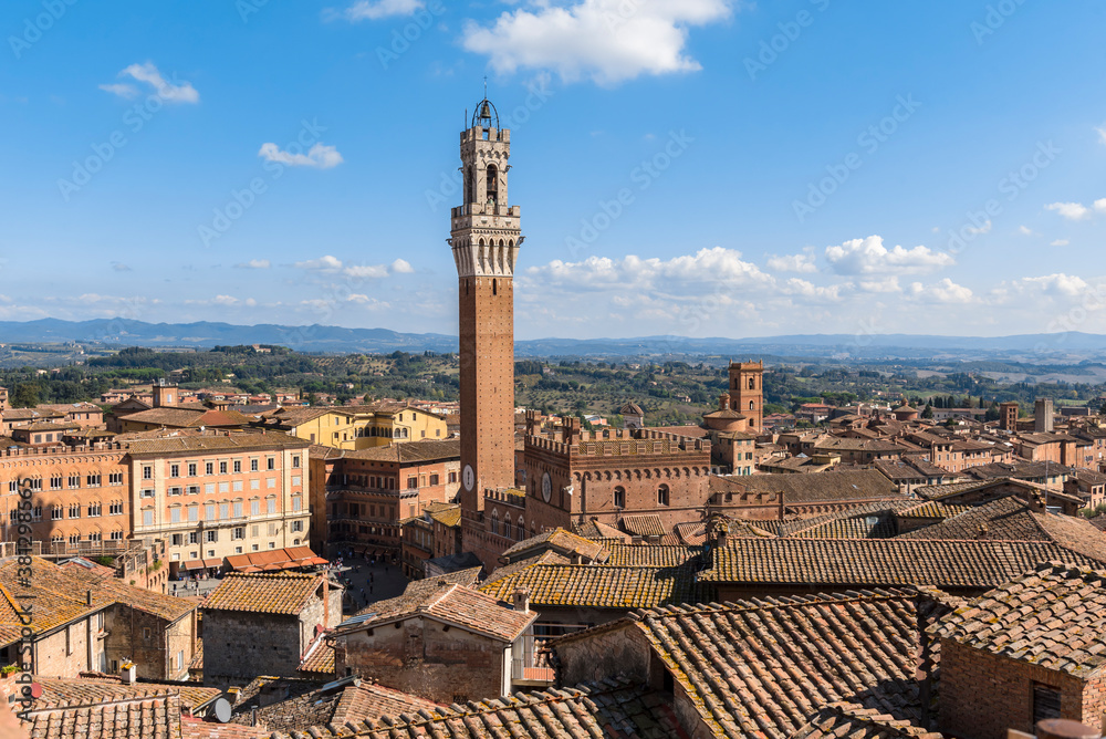 Top view of the rooftops, bell tower and surroundings of Siena, Italy