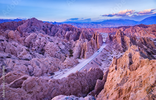 Landscape with dirt road in the Quebrada de las Flechas in the blue hour after sunset photo