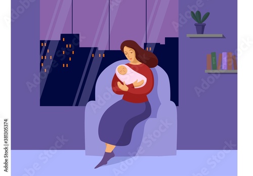 Young woman with a newborn late at night 