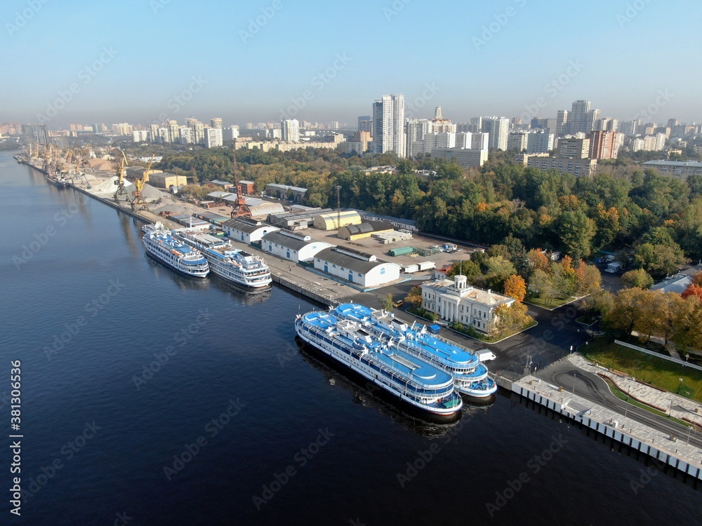 Aerial view flight over the passenger terminal in port. The new building of the Northern River Station in Moscow from a height on a clear day in autumn