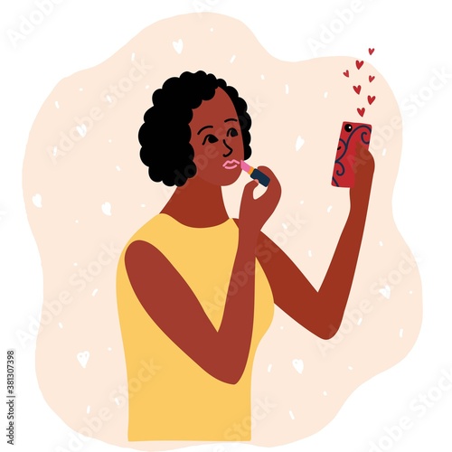 African black Woman beauty blogger showing latest trend in lips makeup tutorials. Creating content and posting it on social media. online channel concept