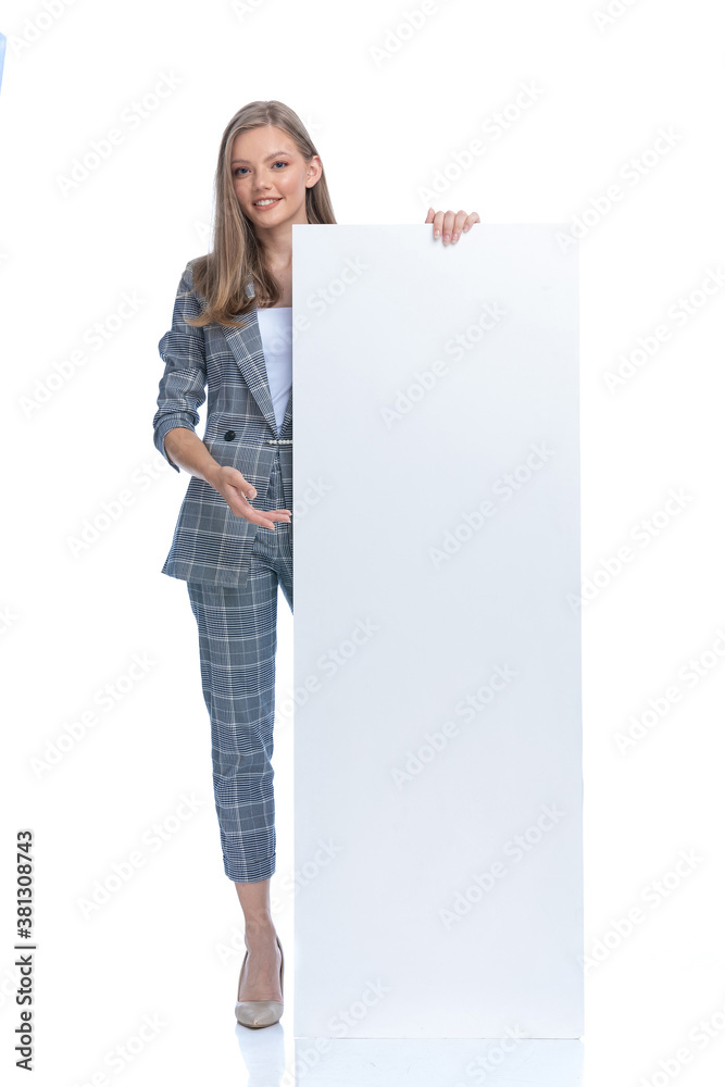 happy businesswoman holding and presenting empty board happy businesswoman holding and presenting empty board