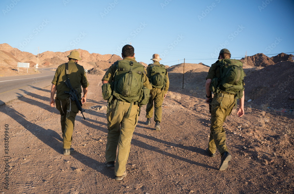 Fototapeta premium Soldiers patrol in desert