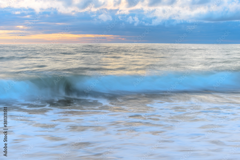 Beach in the evening with moving water which brings an effect to the surface of the sea. Beach in the evening with moving water which brings an effect to the surface of the sea.