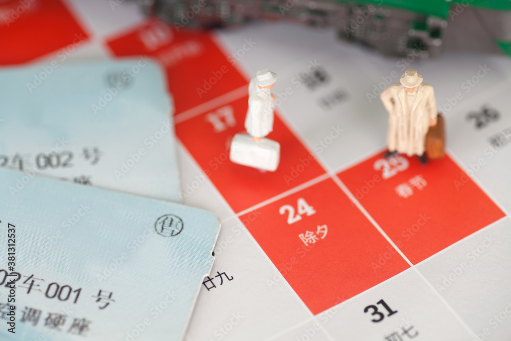 Still life items related to Chinese Spring Festival transport displayed on the background of the desk calendar Still life items related to Chinese Spring Festival transport displayed on the background of the desk calendar