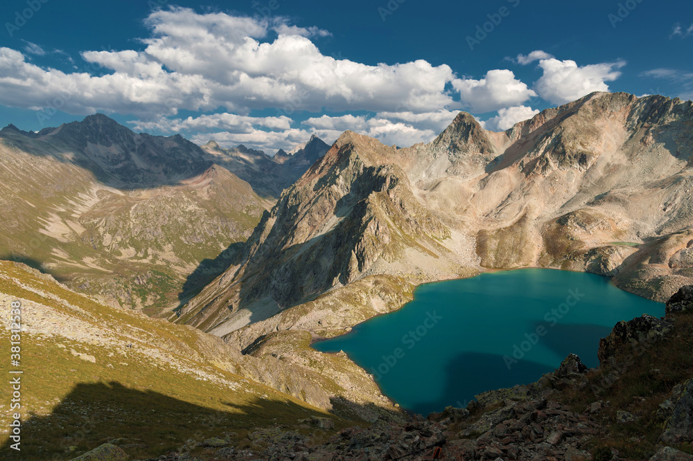 Day landscape mountain lake high in the mountains against the background of the Caucasian highlands in the North Caucasus