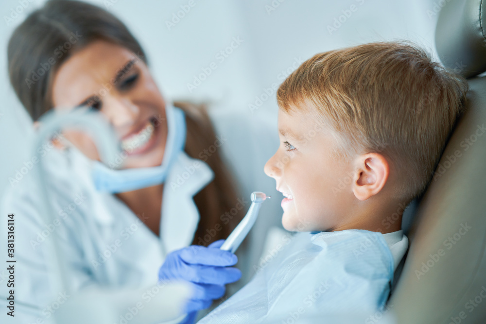 Little boy and female dentist in the dentists office