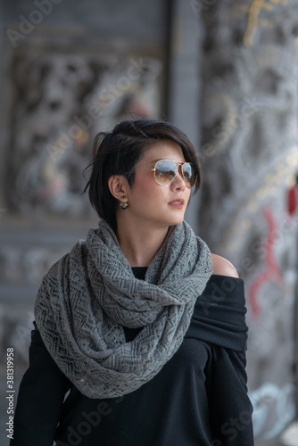 smiling girl wear grey scarf