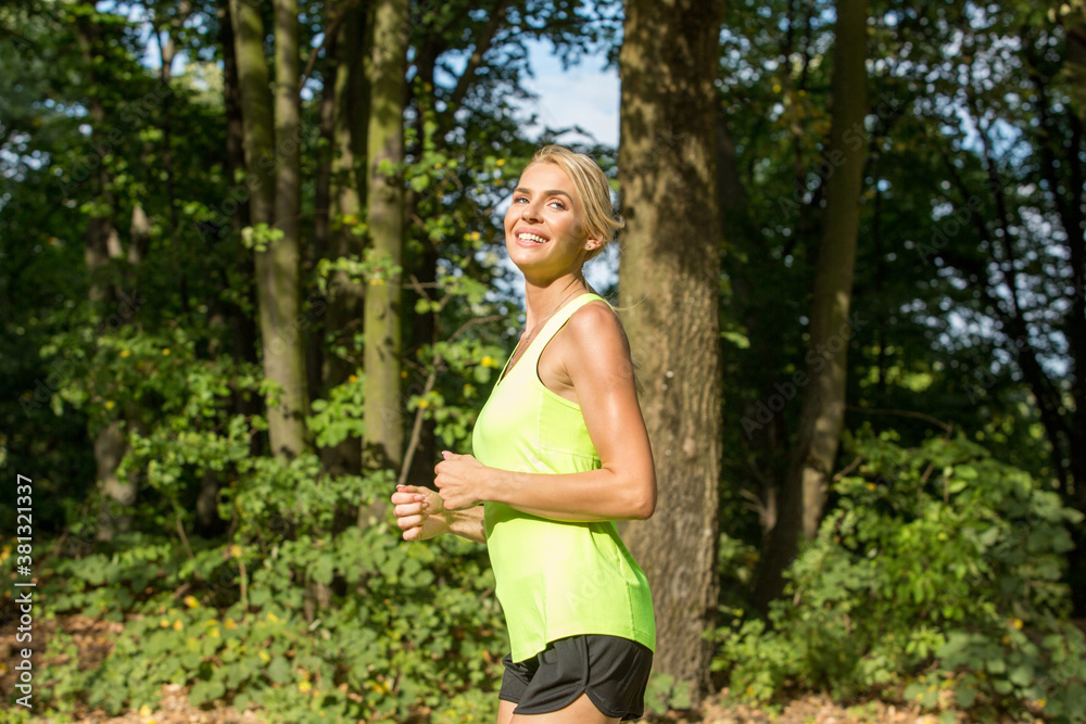 Handsome woman jogging in the nature Handsome woman jogging in the nature