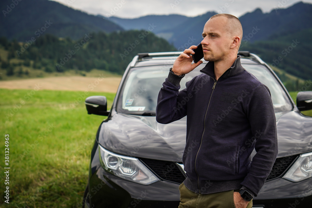 A young man calls the insurance company to report that his car has broken down. A young man calls the insurance company to report that his car has broken down.