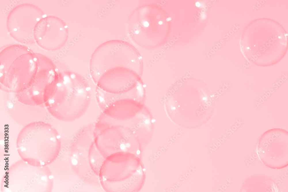 Pink soap bubbles float in the air. Soap bar natural background. Pink soap bubbles float in the air. Soap bar natural background.