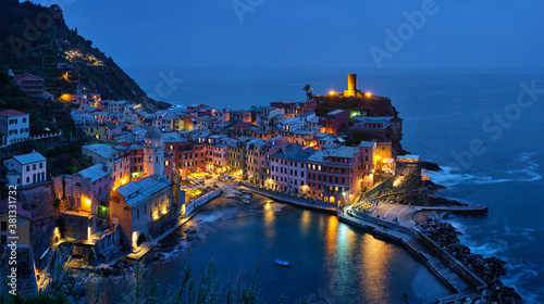 View of Vernazza village popular tourist destination in Cinque Terre National Park a UNESCO World Heritage Site, Liguria, Italy view illuminated in the night from Azure trail