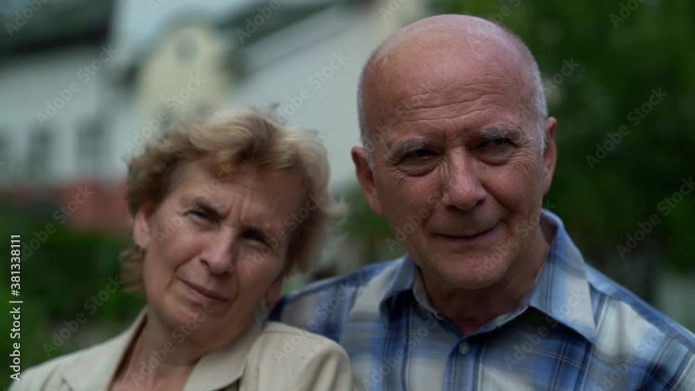 elderly married pair, portrait in city, aged couple of man and woman are embracing