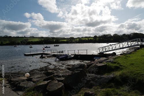 The Mooring - River Teifi estuary - in silhouette with the sun reflecting on the river