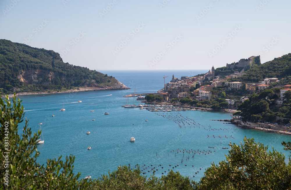 Fototapeta premium Portovenere, Liguria, Italy. June 2020. Sea view from the village hill: a magnificent view of the bay crossed by numerous boats of various sizes.