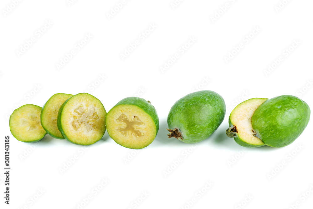 Whole and sliced feijoa fruits isolated on white background Whole and sliced feijoa fruits isolated on white background