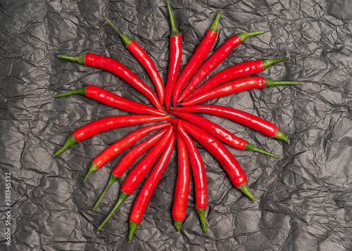 red hot chili peppers in a circle on a black background