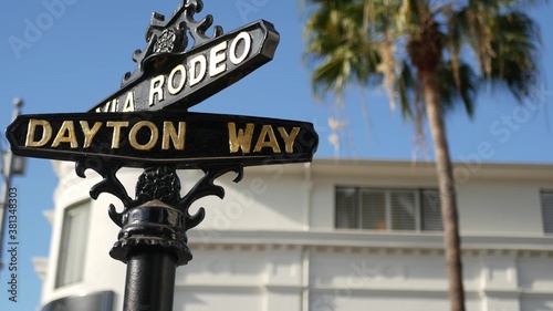 World famous Rodeo Drive symbol, Cross Street Sign, Intersection in Beverly Hills. Touristic Los Angeles, California, USA. Rich wealthy life consumerism, Luxury brands and high-class stores concept.