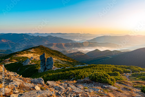Schilderij op canvas Amazing sunrise high in the mountains