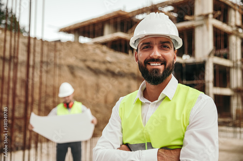 Positive builder on construction site photo