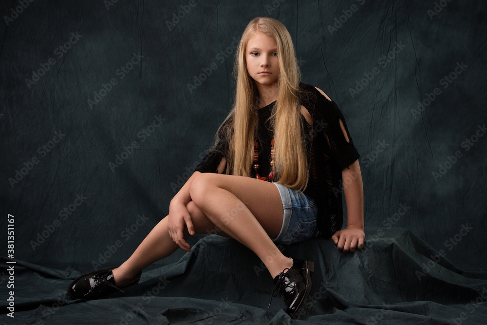 Beautiful blonde girl in jean shorts Stock Photo | Adobe Stock