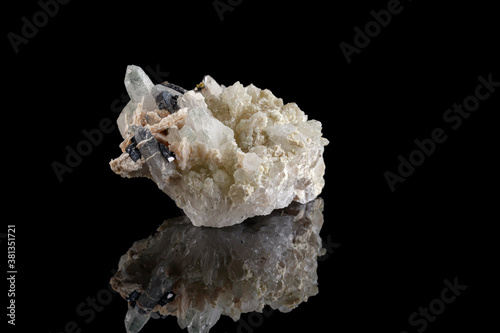 macro stone mineral Calcite Galena pyrite on a black background
