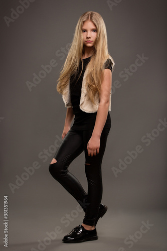 Beautiful young teen girl with long blonde hair with natural make-up