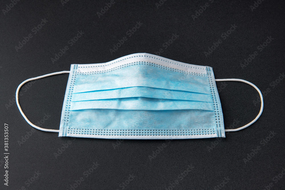 Doctor mask and corona virus protection on a black background